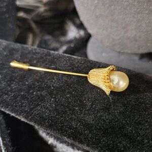 Gold toned faux pearl pin